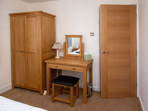 Devonshire Living Dorset Natural Oak All Hanging Wardrobe, Dressing Table Stool, Dressing Table Mirror and Laptop Table in a happy customer's home