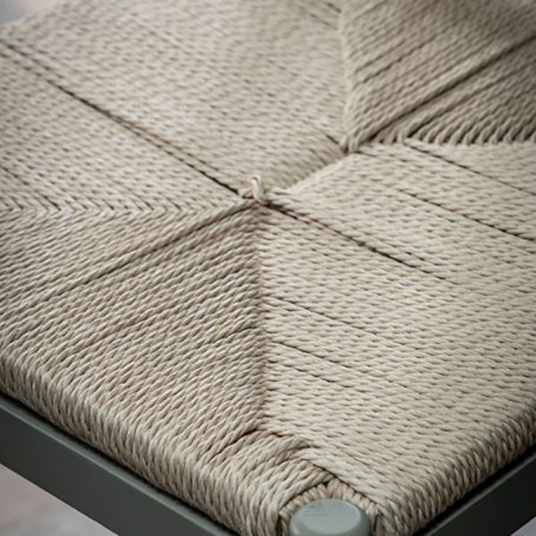 Close up image showing the hand woven rope seat and the grey painted finish on the Harrow Prairie oak bar stool