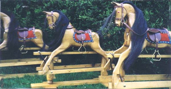 A Trio of Large Rocking Horses in Natural Polished Pine Finish