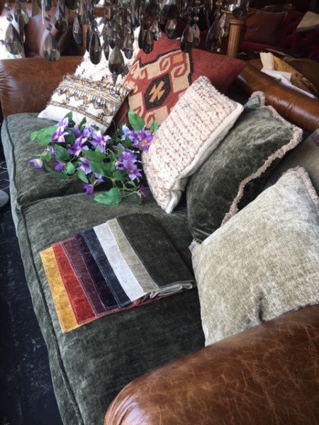Tetrad Constable Midi Sofa on display with fabric swatches