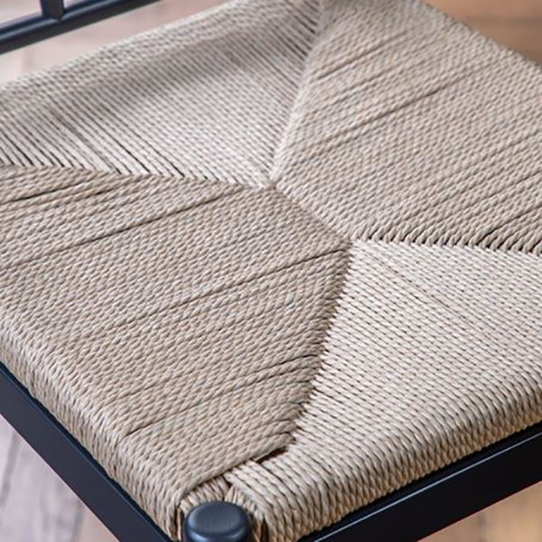 Close up image showing the hand woven rope seat and the dark blue painted finish on the Eton Meteor oak bar stool