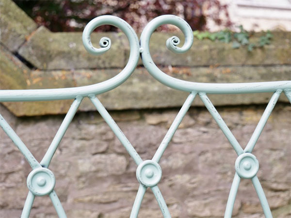 Pistachio Green Button Metal Garden Bench - Close up image of part of the back of the bench