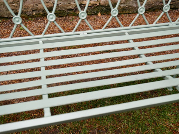 Pistachio Green Button Metal Garden Bench - Close up image showing the button design on the back of the bench