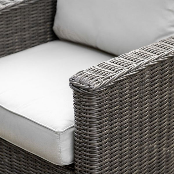 Harvest Direct Calvi Natural Square Outdoor Sofa Set - Close up image of the armchair's rattan finish & seat cushion