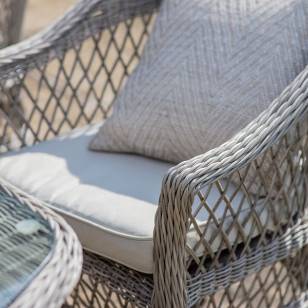 Harvest Direct Menton Stone 6 Seater Outdoor Dining Set - Close up image of the dining table top & a dining chair