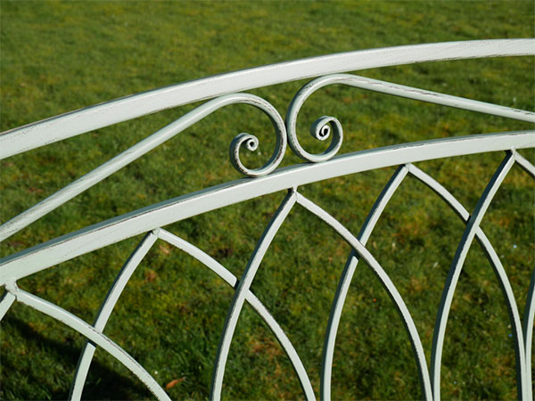 Olive Green Metal Garden Arch and Seat - Close up image showing the distressed olive green paint finish on part of the back of the seat