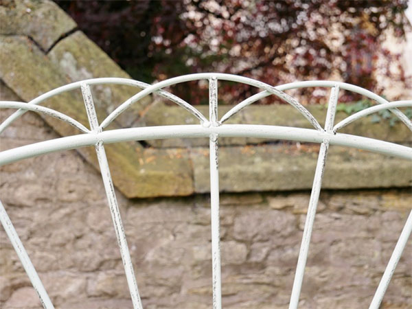 Pistachio Green Sunrise Metal Garden Bench - Close up image of the central part of the sunrise pattern on the bench