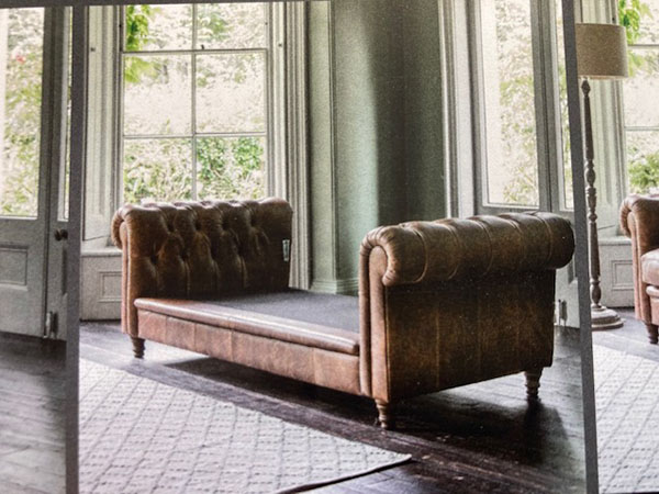 The base and arms of the Harvest Direct Design Project Cindy 1 Vintage Brown 3 Seater Leather Scatter Back Sofa