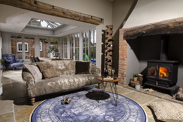 Tetrad Jacaranda Midi Sofa with a Jacaranda Chair in the background