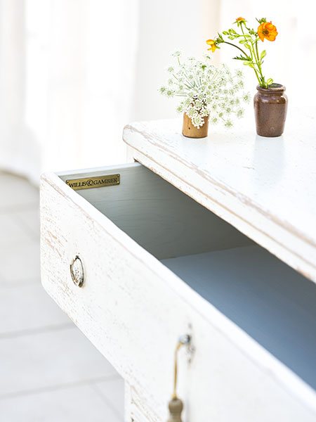 Willis & Gambier Atelier 3 Drawer Chest - Close up image showing thedistressed aged dusty white finish and the interior of part of the top drawer